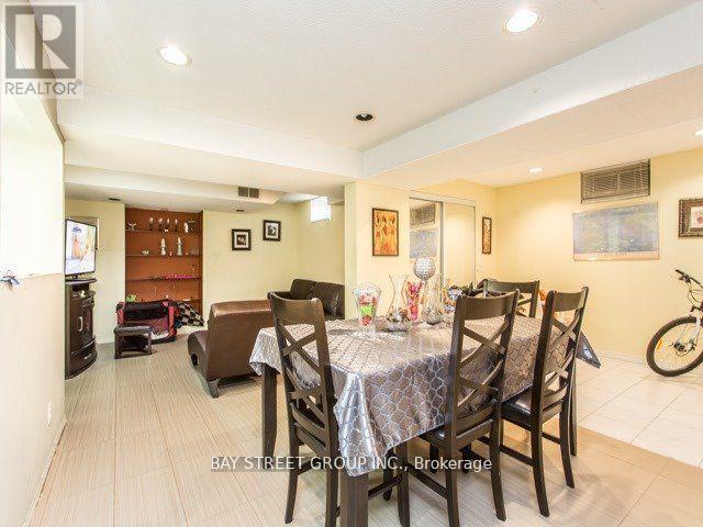 A dining room with a table set for six.
