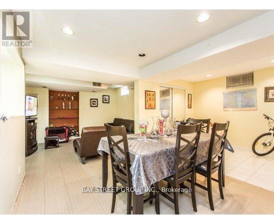 A dining room with a table set for six.
