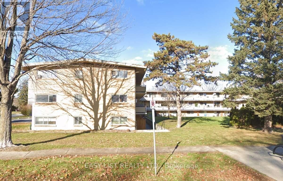 A building with a tree in front of it.