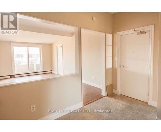 A room with a window and a door is on the market.
