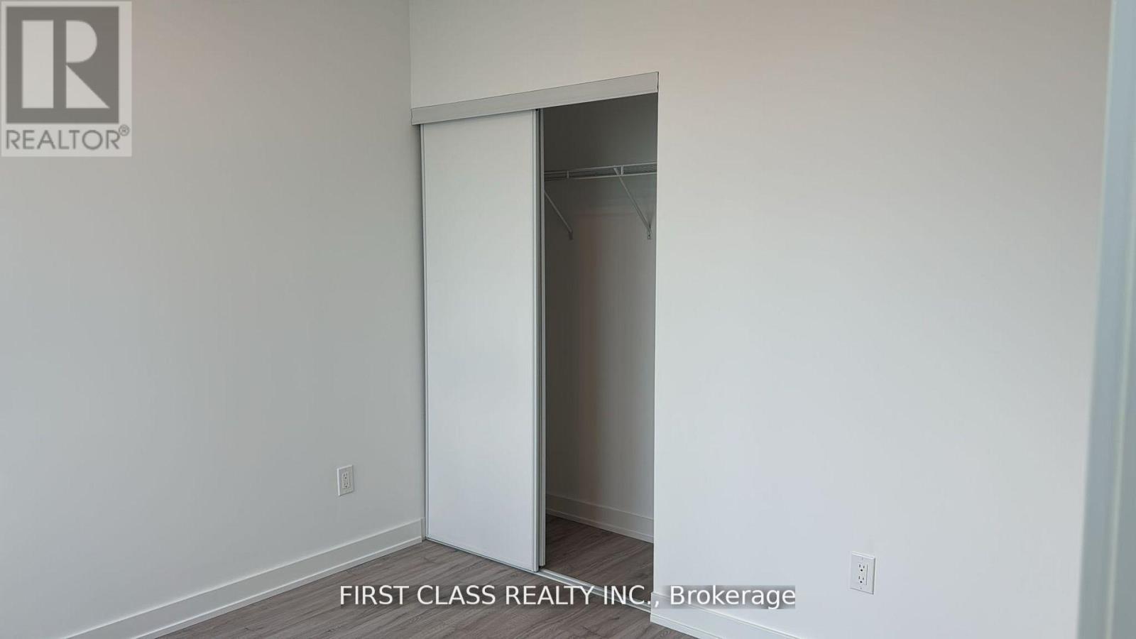 A room with a doorway leading to another room.