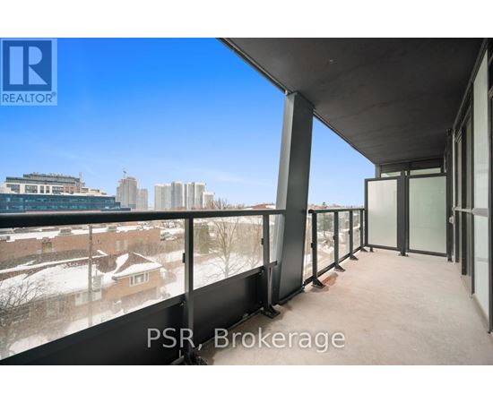 A balcony with a view of a cityscape and buildings.