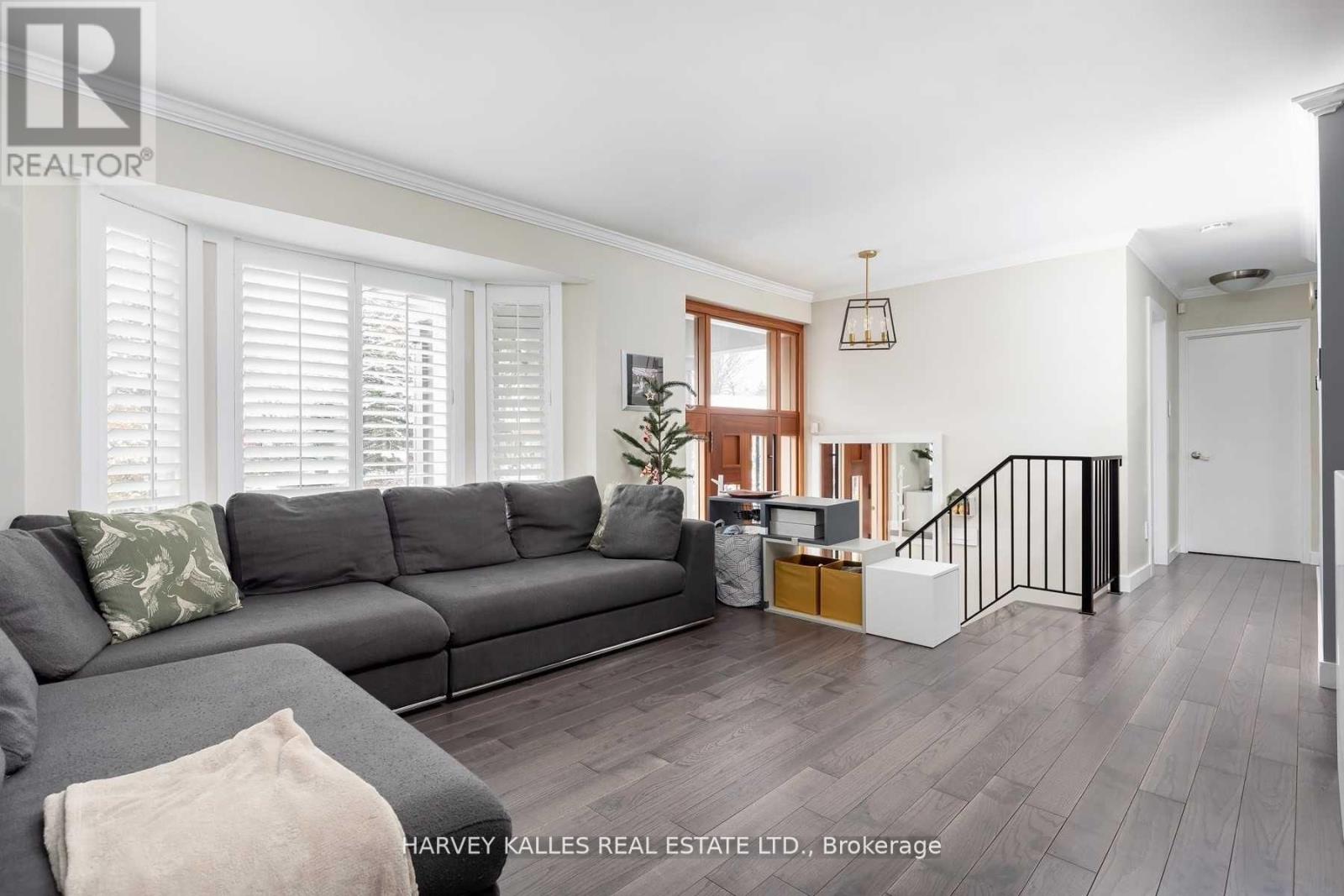 A living room with a grey sofa and a wooden coffee table.
