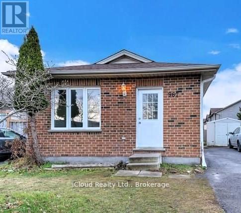 A small brick house with a white door and windows is for sale.
