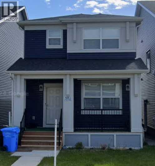 A two-story house with a blue front door and white trim.