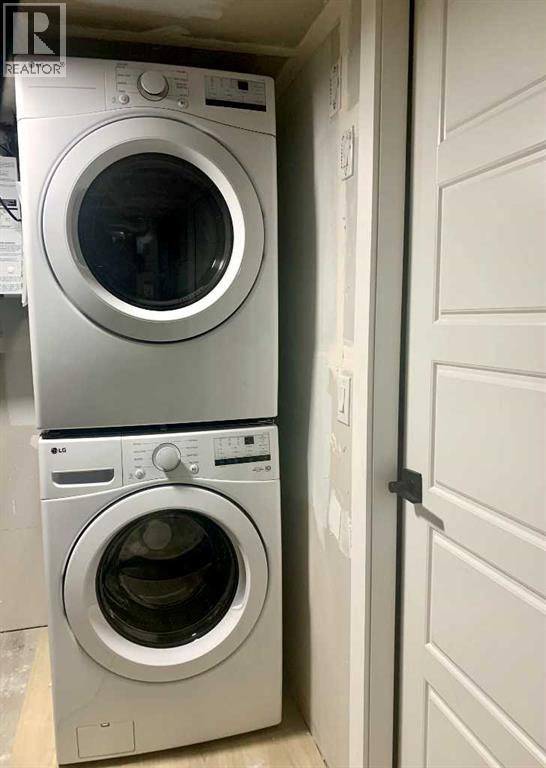 Two front loading washing machines in a laundry room.