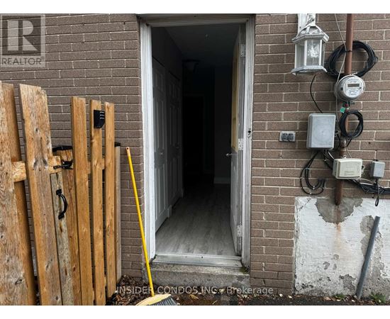 A doorway with a sign that says REALTOR on the wall.
