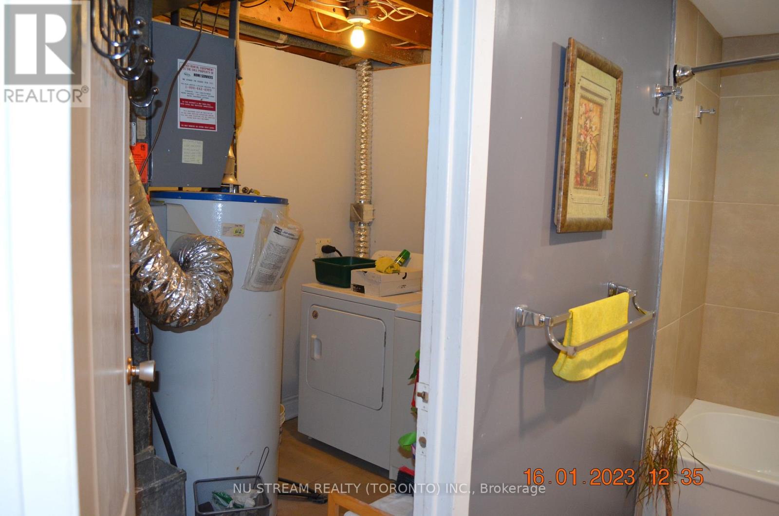 A bathroom with a toilet, a sink, and a bathtub.
