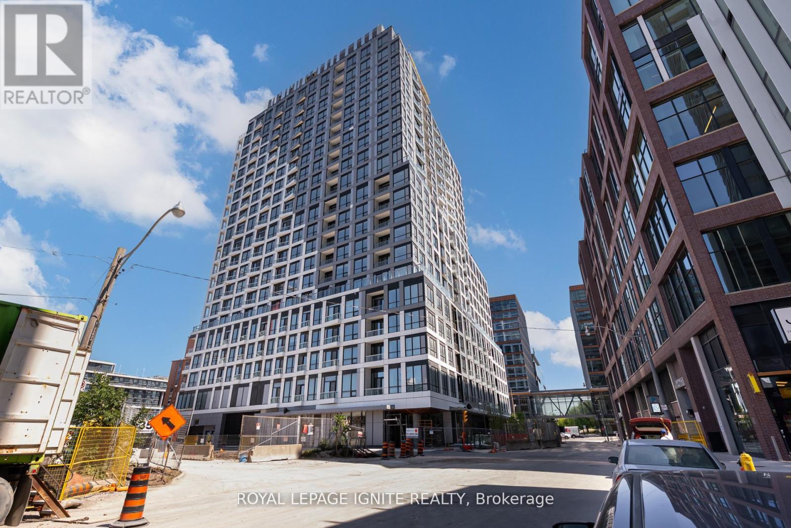 A tall building under construction with a clear blue sky in the background.