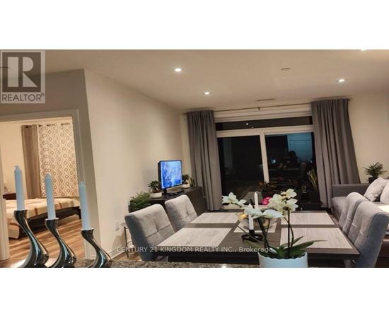 A well-lit dining room with a table set for six.