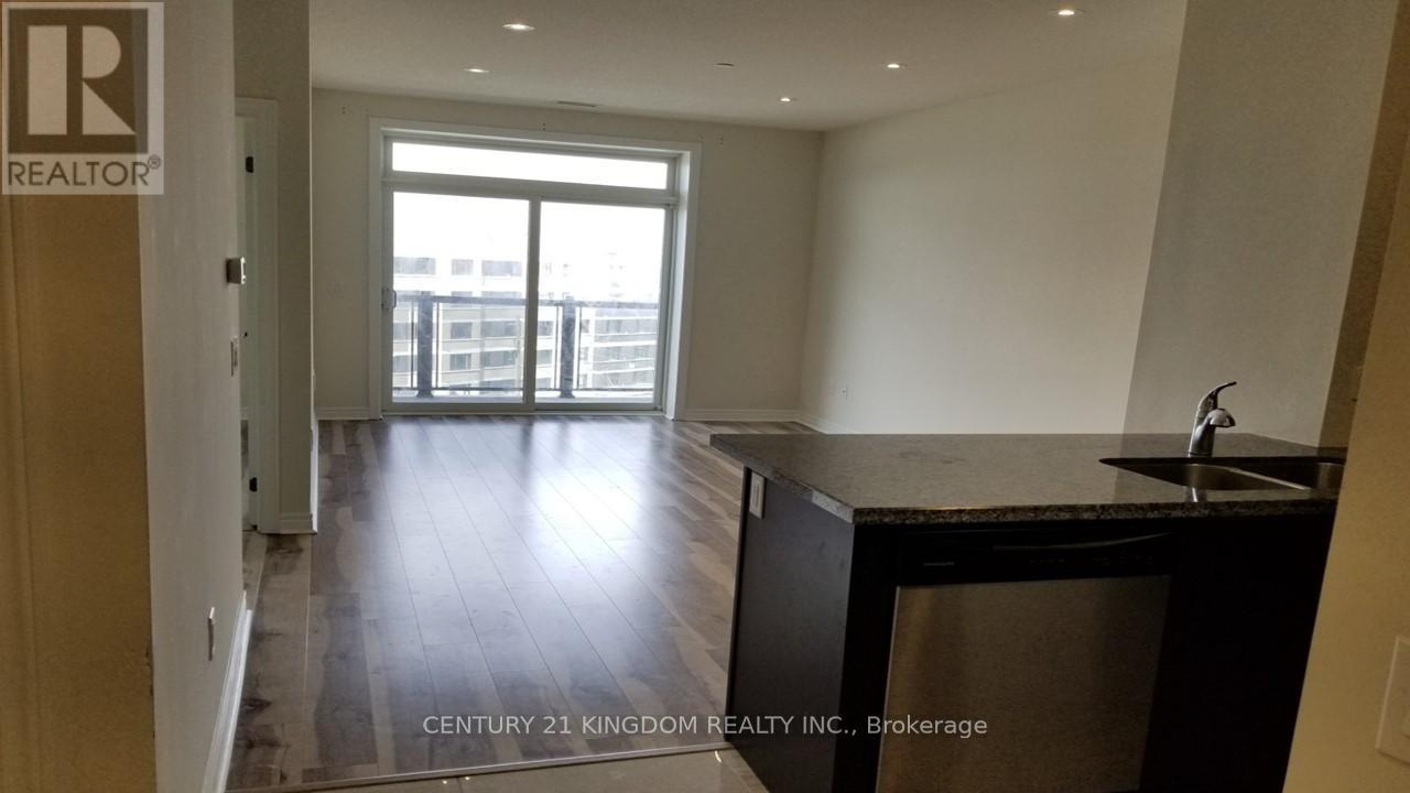 A kitchen area with a sink and a window.