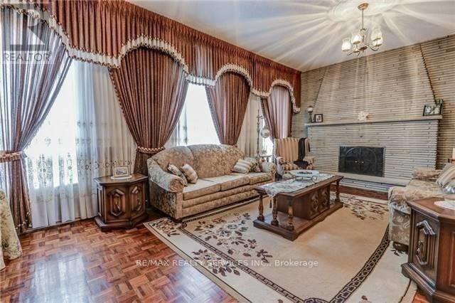 A living room with a fireplace and a couch.
