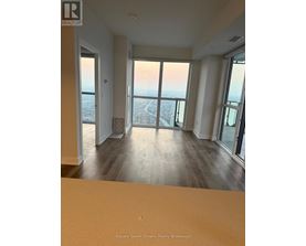 A real estate brokerage office with a view of the city.