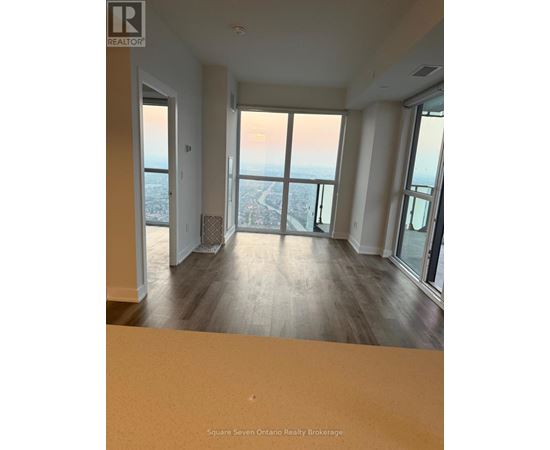A real estate brokerage office with a view of the city.