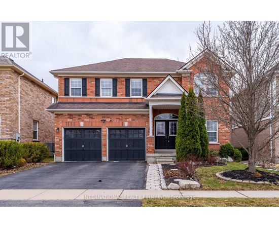 A brick house with a black garage door.