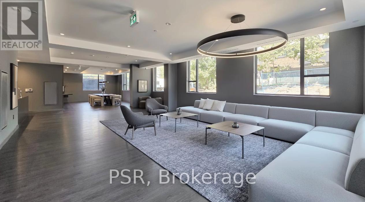 A modern living room with a large sofa and a coffee table.