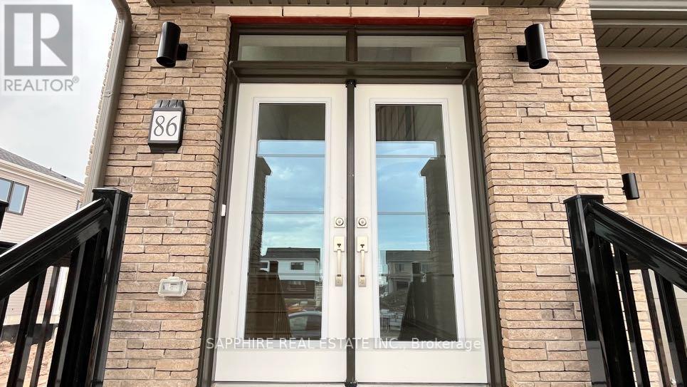 A real estate sign is on the front door of a house.