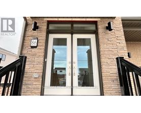 A real estate sign is on the front door of a house.
