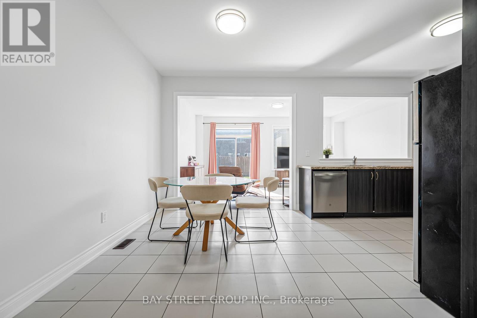 A dining room with a table and chairs is shown.