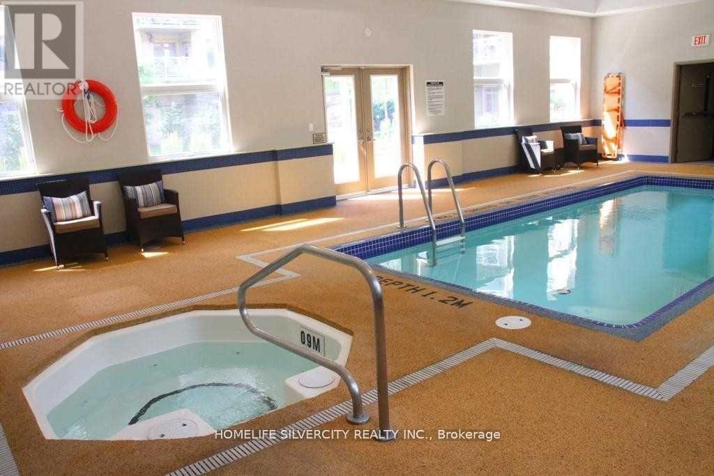 A pool with a hot tub in the middle of it.