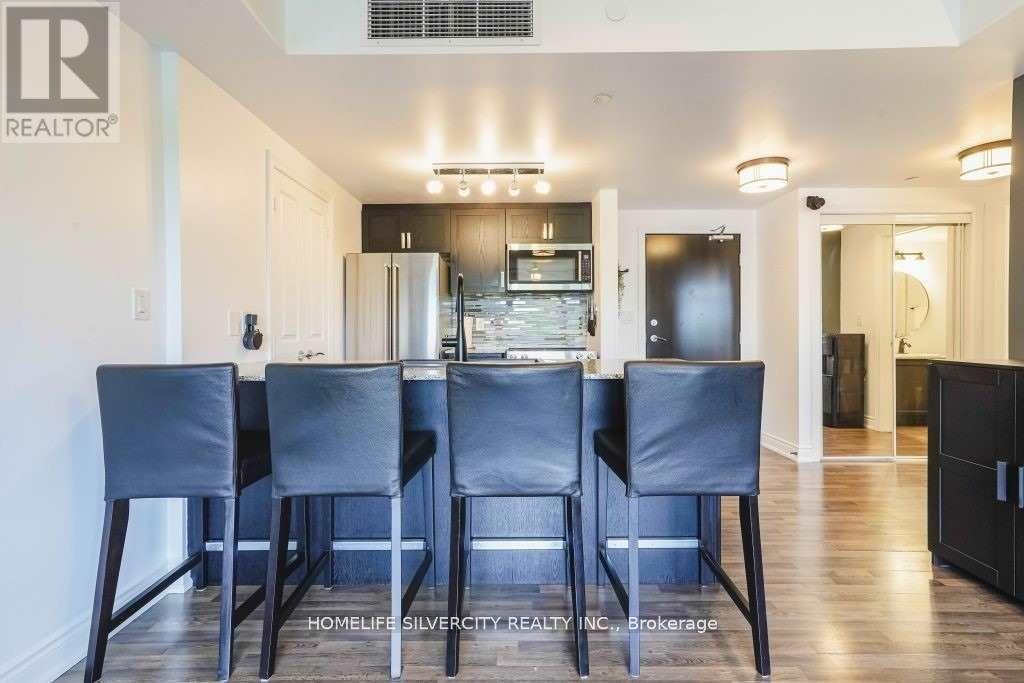 A dining room with a table set for four.
