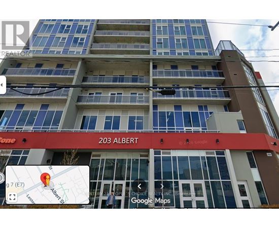 A building with the sign 203 Albert in red on the front.
