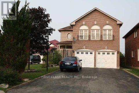 A house with a car parked in front of it.