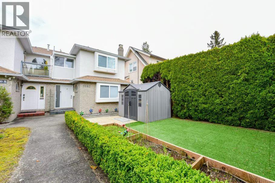 A house with a white garage door is for sale.