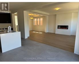 A living room with a fireplace and a television.