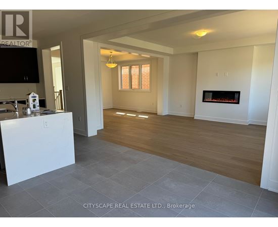 A living room with a fireplace and a television.