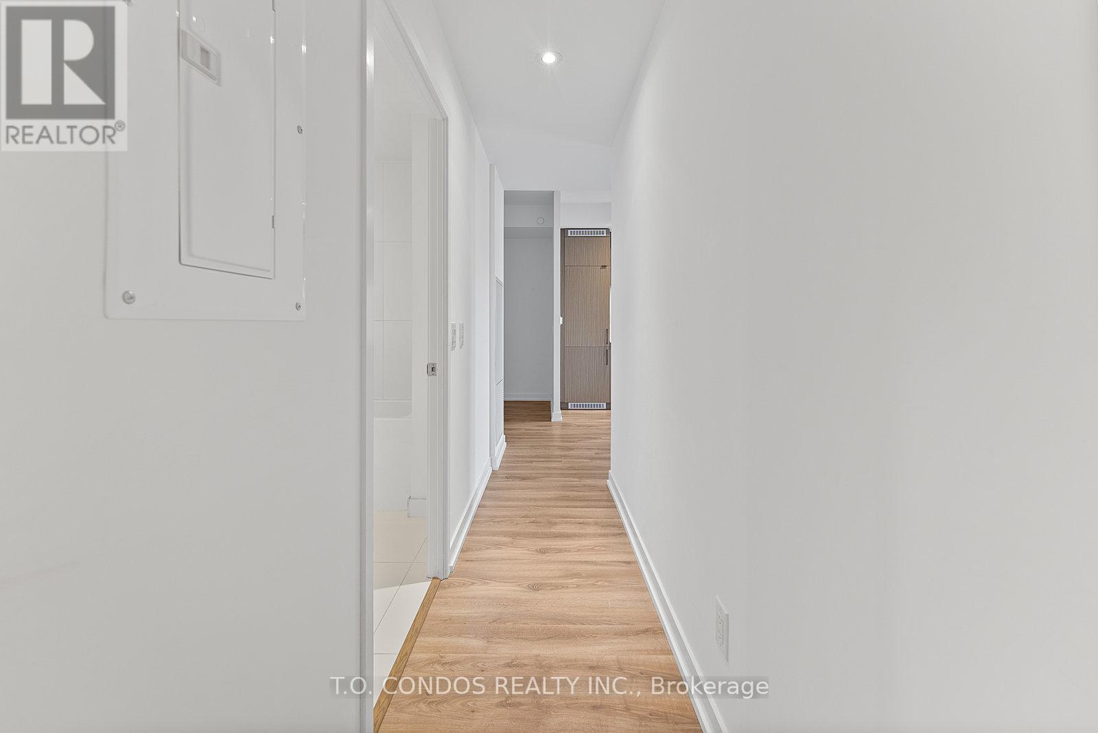 A long hallway with a door at the end.