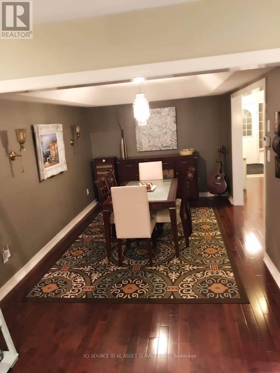 A dining room with a table set for two.