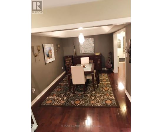 A dining room with a table set for two.
