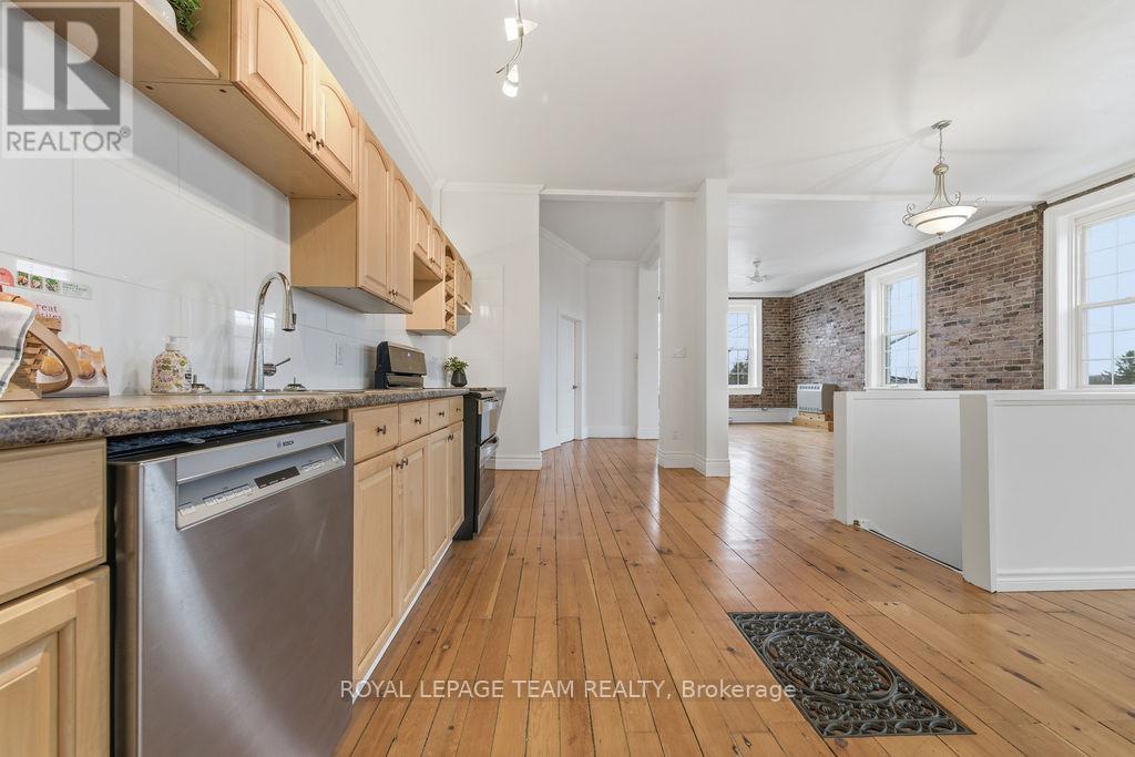 A kitchen with wooden cabinets and a dishwasher.