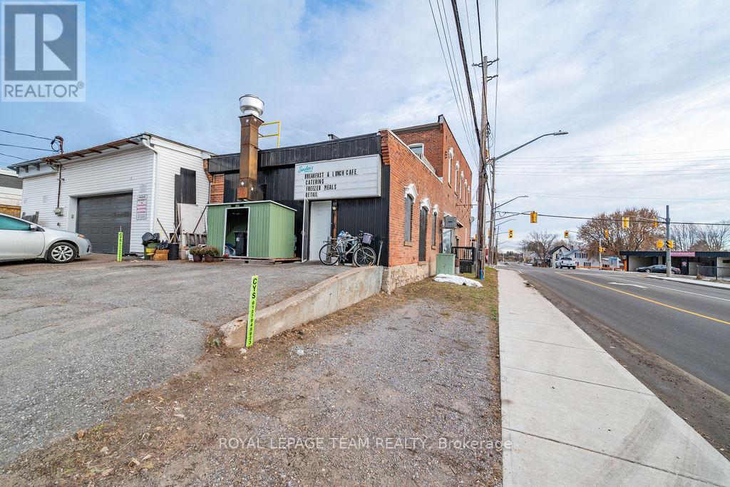 A street view with a building that has a sign for "ROYAL LEPAGE TEAM REALTOR".