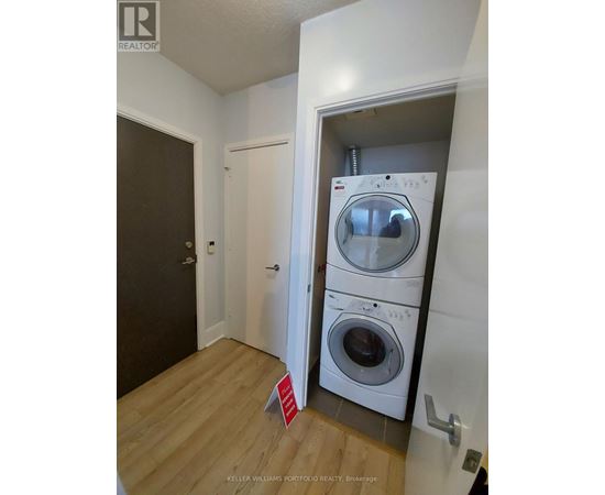 A realtor photo of a laundry room with a washer and dryer.