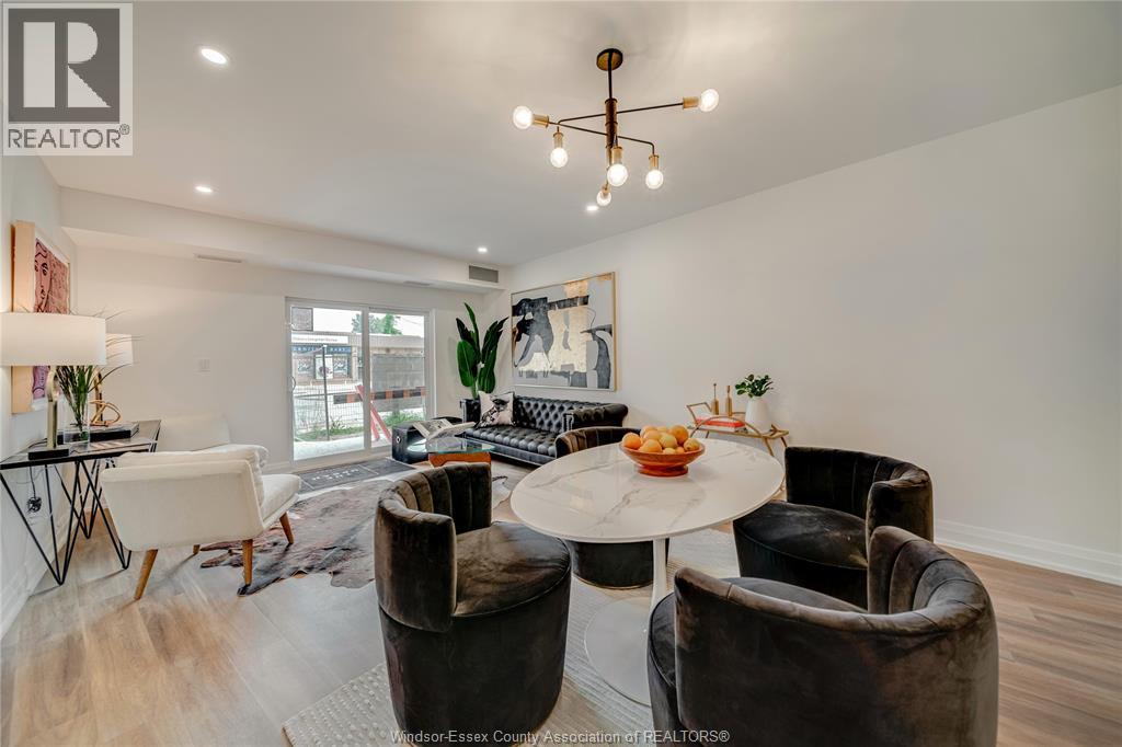 A well-lit room with a table and chairs.