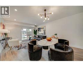 A well-lit room with a table and chairs.