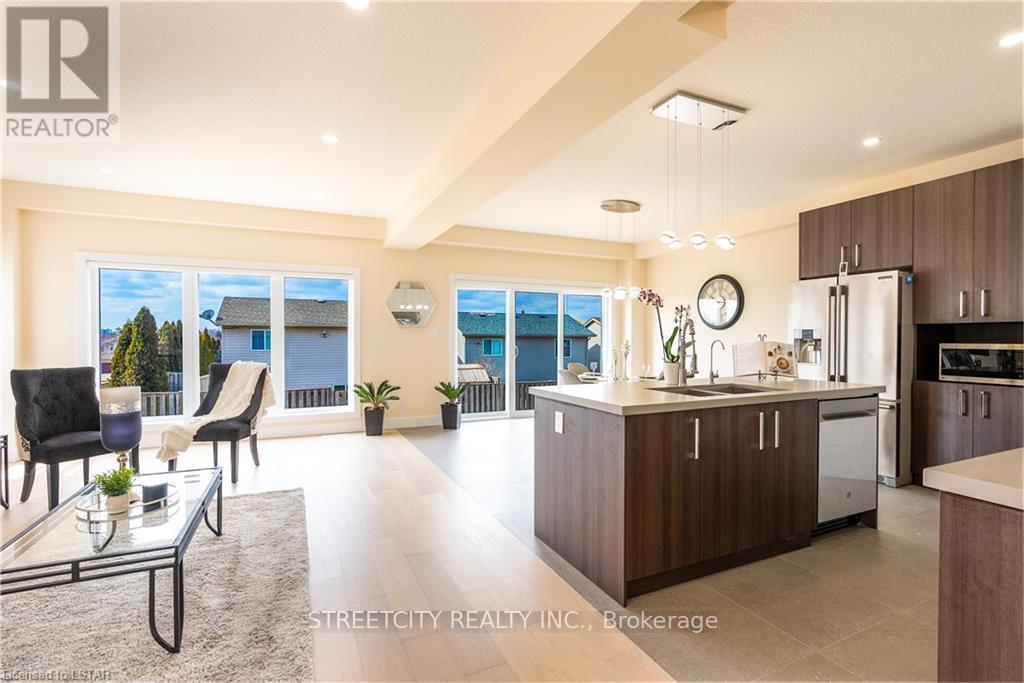A modern kitchen with a dining table and chairs is shown.