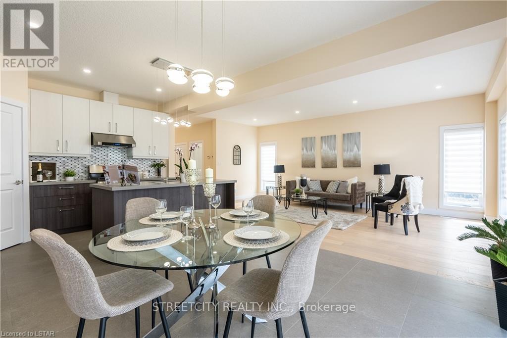 A modern dining room with a glass table and chairs.