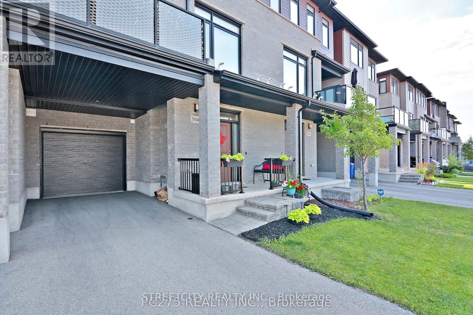 A modern house with a garage and a driveway.