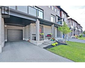 A modern house with a garage and a driveway.