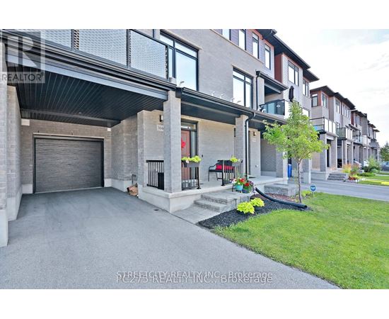 A modern house with a garage and a driveway.