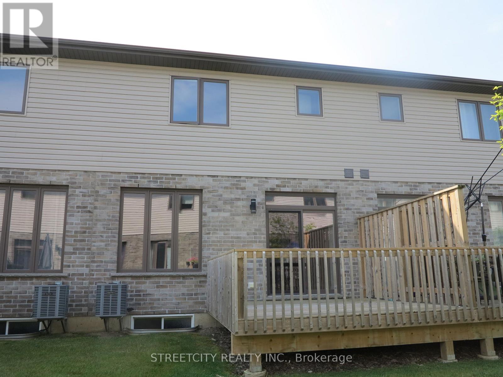 A building with a wooden deck in front.