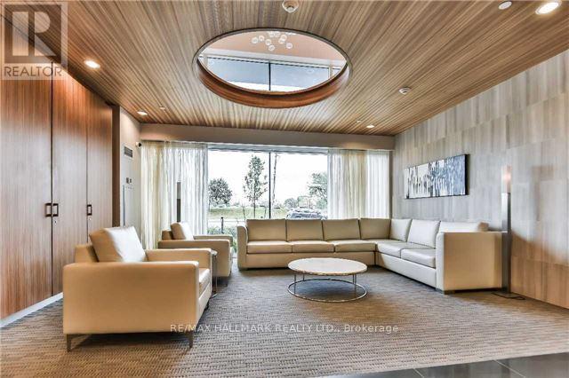 A living room with a large window and a skylight.