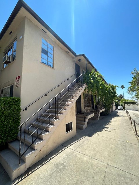 A building with a staircase leading to the second floor.