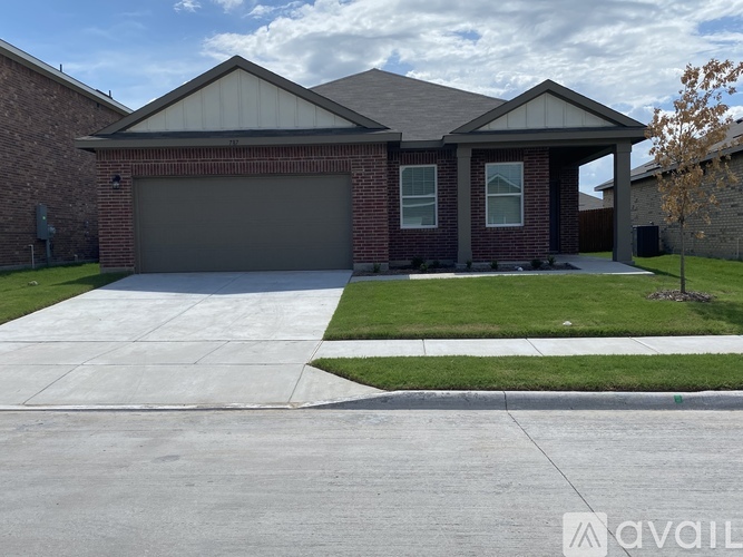 A house with a garage and a driveway.