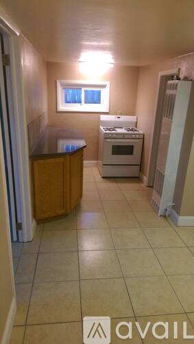 A kitchen with a stove and an oven.