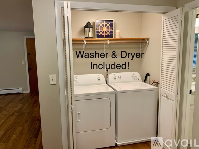 A laundry room with a washer and dryer included.