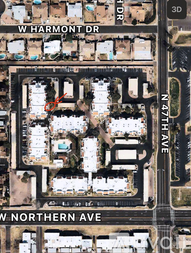 A 3D aerial view of a street intersection at W Harmont Dr and W Northern Ave.
